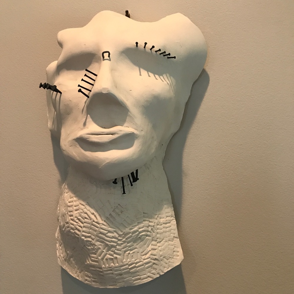 Unique Fired Clay Face with Nails